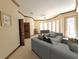 Spacious living room with comfortable seating, foosball table, and large windows at 3050 Wentworth Way, Tarpon Springs, FL 34688