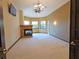 Spacious main bedroom with fireplace, carpet flooring, and large windows at 3050 Wentworth Way, Tarpon Springs, FL 34688