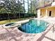 Relaxing pool and spa area with screened enclosure at 3050 Wentworth Way, Tarpon Springs, FL 34688