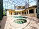 Resort-style pool and spa with screened enclosure at 3050 Wentworth Way, Tarpon Springs, FL 34688