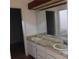 Bathroom with double vanity and large mirror at 3346 Foxridge Cir, Tampa, FL 33618