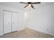 Bright bedroom with tile flooring and double door closet at 3414 W Louisiana Ave, Tampa, FL 33614