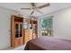 Cozy bedroom with wood furniture and a view of the outdoors at 3707 66Th W St, Bradenton, FL 34209