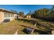 Backyard view with patio furniture and shed at 448 55Th Ne Ave, St Petersburg, FL 33703