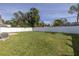 Spacious backyard featuring a grassy lawn and a white fence at 4501 Helena Ne St, St Petersburg, FL 33703