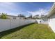 Spacious backyard with a privacy fence and lush lawn at 4501 Helena Ne St, St Petersburg, FL 33703