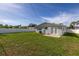 Expansive backyard, grassy lawn, and white fence at 4501 Helena Ne St, St Petersburg, FL 33703