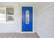 Bright blue front door with decorative glass accents at 4501 Helena Ne St, St Petersburg, FL 33703