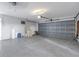 Spacious garage with light-grey walls and overhead door at 4501 Helena Ne St, St Petersburg, FL 33703
