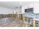 Renovation of a kitchen with white cabinets, light blue tile backsplash, and new flooring at 4501 Helena Ne St, St Petersburg, FL 33703