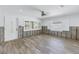 Renovation in progress: Living room with new tile floors and exposed framing at 4501 Helena Ne St, St Petersburg, FL 33703