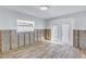 Room with new tile floors and exposed framing during renovation at 4501 Helena Ne St, St Petersburg, FL 33703