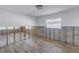 Under construction: Living area with new flooring and exposed wall studs at 4501 Helena Ne St, St Petersburg, FL 33703