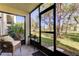 Relaxing screened porch overlooking a lush green backyard at 5085 1St Ne St # 143, St Petersburg, FL 33701