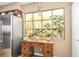 Charming kitchen nook with stained glass window and wooden desk at 5729 Puerta Del Sol S Blvd # 477, St Petersburg, FL 33715