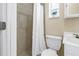 Clean bathroom featuring tiled shower, modern toilet, and a vanity with sink at 6366 38Th N Ave, St Petersburg, FL 33710