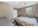 Spacious bedroom with floral bedding and ceiling fan at 6366 38Th N Ave, St Petersburg, FL 33710