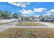 Ranch style home with a long driveway and white fence at 6366 38Th N Ave, St Petersburg, FL 33710