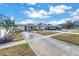 Nice curb appeal! This yellow house features a blue door and a spacious driveway at 6366 38Th N Ave, St Petersburg, FL 33710