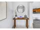 Bright entryway featuring a decorative glass front door visible in the mirror, neutral decor, and a console table at 6366 38Th N Ave, St Petersburg, FL 33710