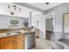 Cozy eat-in kitchen area featuring stainless steel appliances, granite countertops and adjacent living area at 6366 38Th N Ave, St Petersburg, FL 33710