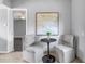 Cozy sitting area features a modern table with flowers and contemporary wall art at 6366 38Th N Ave, St Petersburg, FL 33710
