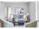 Comfortable living room featuring a plush sofa, stylish decor, and ample natural light at 6366 38Th N Ave, St Petersburg, FL 33710