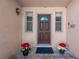 Inviting front entrance with decorative planters at 7002 124Th Ter, Largo, FL 33773