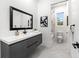 Modern bathroom with a floating vanity, a toilet, and a walk-in shower at 703 W Plymouth St, Tampa, FL 33603