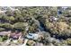 Aerial view of home near waterway, showcasing neighborhood context at 7108 Riverwood Blvd, Tampa, FL 33615