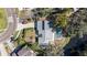 Aerial view showing house, pool, and location by waterway at 7108 Riverwood Blvd, Tampa, FL 33615