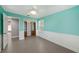 Light teal bedroom with built-in shelving and tile floors at 7108 Riverwood Blvd, Tampa, FL 33615