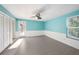 Light and airy bedroom with ceiling fan and updated flooring at 7108 Riverwood Blvd, Tampa, FL 33615