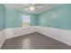 Light teal bedroom with window and tile floors at 7108 Riverwood Blvd, Tampa, FL 33615