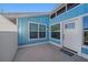 The front entrance features a white door and light blue siding at 7108 Riverwood Blvd, Tampa, FL 33615