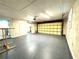 Garage with off-white walls and large garage door at 7108 Riverwood Blvd, Tampa, FL 33615