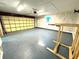 Spacious garage with light gray floor and wood paneling at 7108 Riverwood Blvd, Tampa, FL 33615