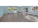 Sunlit Gathering room with sliding glass doors and tile floors at 7108 Riverwood Blvd, Tampa, FL 33615