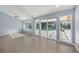 Bright Gathering room with sliding doors opening to a pool and patio at 7108 Riverwood Blvd, Tampa, FL 33615