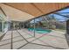 Screened pool area with brick coping and covered patio at 7108 Riverwood Blvd, Tampa, FL 33615