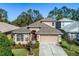 Charming two-story home with a two-car garage and landscaped yard at 7815 Blue Spring Dr, Land O Lakes, FL 34637