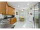 Kitchen featuring wooden cabinetry, dark countertops, and stainless steel appliances at 7815 Blue Spring Dr, Land O Lakes, FL 34637