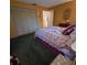 Bedroom with double bed, closet, and carpet at 855 Pinewood W Ter, Palm Harbor, FL 34683