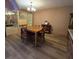 Spacious dining room featuring hardwood floors and a chandelier at 855 Pinewood W Ter, Palm Harbor, FL 34683