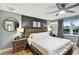 Main bedroom with wood flooring and modern decor at 8718 Hickorywood Ln, Tampa, FL 33615