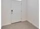 Simple entryway with white door and neutral flooring at 8751 Falling Blue Pl, Riverview, FL 33578