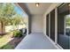 Covered patio with sliding glass doors and a view of the backyard at 8751 Falling Blue Pl, Riverview, FL 33578