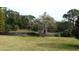 Serene pond with lush vegetation at 915 Rolling Hills Dr, Palm Harbor, FL 34683