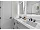 Double vanity bathroom with white cabinets and quartz countertops at 946 Highland Ave # 65, Dunedin, FL 34698