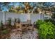 Small, private patio with a table and chairs at 946 Highland Ave # 65, Dunedin, FL 34698